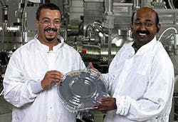 FIGURE 1. Researchers Jamal Ramdani (left) and Ravi Droopad hold the world&apos;s first 12-in. GaAs-on-silicon wafer.