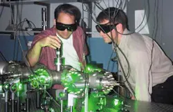 University of Nebraska researchers Herman Batelaan (right) and Daniel Freimund, shown here in the laboratory, modified a basic physics experiment to become the first to observe the Kapitza-Dirac effect—an accomplishment that, among other things, may lead to measuring devices that are thousands of times more accurate than those currently in use.