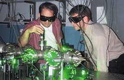 University of Nebraska researchers Herman Batelaan (right) and Daniel Freimund, shown here in the laboratory, modified a basic physics experiment to become the first to observe the Kapitza-Dirac effect&mdash;an accomplishment that, among other things, may lead to measuring devices that are thousands of times more accurate than those currently in use.