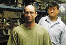 A new and flexible approach to the synthesis of coherent light has been demonstrated by researchers Robert Shelton (left) and Jun Ye, shown here in the laboratory.