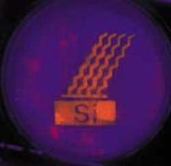 Porous silicon emits orange light upon ultraviolet (365-nm) irradiation. After exposure of this sample to boiling base (pH 12 aqueous KOH), only the functionalized areas still emit light (orange areas). Porous silicon emits orange light upon ultraviolet (365-nm) irradiation. After exposure of this sample to boiling base (pH 12 aqueous KOH), only the functionalized areas still emit light (orange areas).