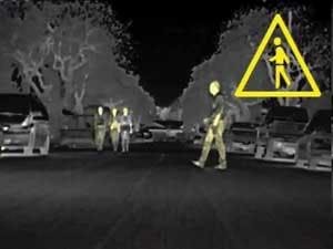 FIGURE 2. A far-infrared night-vision system in the 2009 BMW-7 series activates an alert when a man crosses the street.