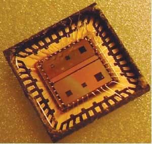 FIGURE 4. The final integrated circuits are contained in an open-cavity package, here viewed from the top.