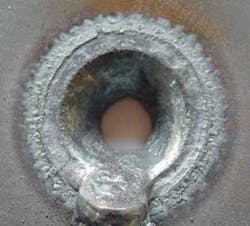 FIGURE 3. In robotic or five-axis beam delivery systems that use fiber lasers, and are powerful enough to melt 9-mm-thick steel plate, regulations require safeguards in the case that malfunctioning software or human error permits a robot to point the beam directly at a wall (or person). An option to prevent shield meltdown is an active-guard system in which the panel or wall has a built-in sensor to detect a hazardous situation and provide a signal that immediately shuts down the laser. FIGURE 3. In robotic or five-axis beam delivery systems that use fiber lasers, and are powerful enough to melt 9-mm-thick steel plate, regulations require safeguards in the case that malfunctioning software or human error permits a robot to point the beam directly at a wall (or person). An option to prevent shield meltdown is an active-guard system in which the panel or wall has a built-in sensor to detect a hazardous situation and provide a signal that immediately shuts down the laser.