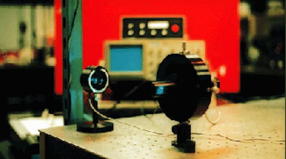Scanning confocal etalon is used for routine analysis of laser spectra in Jeff Dixon&rsquo;s laboratory. Output of an argon-ion laser is sampled by an angled flat mounted on the front of the confocal cavity mount (lower right). Electronic drive unit for the spectrum analyzer is positioned on top of an oscilloscope (background). Proper adjustment of the electronic drive unit and oscilloscope permit the longitudinal-mode spectrum of the argon-ion laser to be displayed.