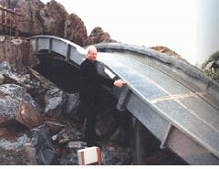 FIGURE 2. Photocell on flume ride triggers picture taking as riders approach water. FIGURE 2. Photocell on flume ride triggers picture taking as riders approach water.