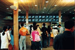 FIGURE 3. Upon exiting ride, customers can select images to purchase from display monitors. All images are saved to disk; only selected ones are printed. FIGURE 3. Upon exiting ride, customers can select images to purchase from display monitors. All images are saved to disk; only selected ones are printed.