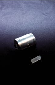 FIGURE 2. Cesium lithium borate (CLBO) offers better performance in the deep-UV than beta-barium borate (BBO) and lithium triborate (LBO), but durability issues require environmental protection (such as the housing shown above) for CLBO and have tended to limit its use to R&D applications. FIGURE 2. Cesium lithium borate (CLBO) offers better performance in the deep-UV than beta-barium borate (BBO) and lithium triborate (LBO), but durability issues require environmental protection (such as the housing shown above) for CLBO and have tended to limit its use to R&D applications.