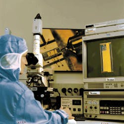 FIGURE 1. All 980-nm-output diode lasers shipped from Uniphase Laser Enterprise are inspected with a microscope incorporating special optics so that the operator can view each chip from any angle (except from underneath). These inspections are recorded on video tape for use in the event that the chip fails subsequently in the field. FIGURE 1. All 980-nm-output diode lasers shipped from Uniphase Laser Enterprise are inspected with a microscope incorporating special optics so that the operator can view each chip from any angle (except from underneath). These inspections are recorded on video tape for use in the event that the chip fails subsequently in the field.