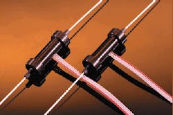 FIGURE 1. Fiberoptic variable attenuator based on a side-polished fiber architecture can be electronically controlled with no moving parts. Insertion loss and backreflection are near-zero. FIGURE 1. Fiberoptic variable attenuator based on a side-polished fiber architecture can be electronically controlled with no moving parts. Insertion loss and backreflection are near-zero.