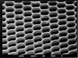 FIGURE 1. Features on the order of a wavelength in size are easily hot-stamped into plastic. Although many types of holograms can be made in the lab, the embossed hologram remains the standard for mass-production. FIGURE 1. Features on the order of a wavelength in size are easily hot-stamped into plastic. Although many types of holograms can be made in the lab, the embossed hologram remains the standard for mass-production.