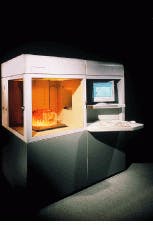 FIGURE 2. Driven by a computer-aided-design and manufacturing system that slices the 3-D digital part model into sections, a stereolithography machine directs a laser to trace a pattern sliced into layers across a polymer bath. This step photocures (solidifies) each slice. The bath table is then lowered, and the laser cures subsequent layers until the 3-D model is complete. FIGURE 2. Driven by a computer-aided-design and manufacturing system that slices the 3-D digital part model into sections, a stereolithography machine directs a laser to trace a pattern sliced into layers across a polymer bath. This step photocures (solidifies) each slice. The bath table is then lowered, and the laser cures subsequent layers until the 3-D model is complete.