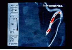 FIGURE 2. Infrared image of a 'warm' power line in a robotic welder indicates potential hazards and breakdowns, making it possible to conveniently schedule repairs for minimum time out of service. FIGURE 2. Infrared image of a 'warm' power line in a robotic welder indicates potential hazards and breakdowns, making it possible to conveniently schedule repairs for minimum time out of service.