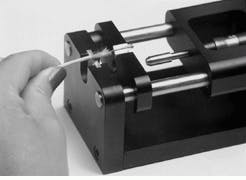 FIGURE 2. Impact mount tool dynamically applies uniform force around the full length of a metal ferrule. FIGURE 2. Impact mount tool dynamically applies uniform force around the full length of a metal ferrule.