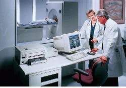 FIGURE 1. In medical diagnostic-imaging procedures, instruments such as this ECAT EXACT positron emission tomograph scanner incorporate hundreds of photomultiplier tubes configured in rings to detect coincident gamma rays that result from annihilation of a positron with an electron. This instrument can detect metastases in cancer victims for evaluating the viability of surgery, detect brain receptors associated with addiction, and study how the brain utilizes glucose during mental processes. FIGURE 1. In medical diagnostic-imaging procedures, instruments such as this ECAT EXACT positron emission tomograph scanner incorporate hundreds of photomultiplier tubes configured in rings to detect coincident gamma rays that result from annihilation of a positron with an electron. This instrument can detect metastases in cancer victims for evaluating the viability of surgery, detect brain receptors associated with addiction, and study how the brain utilizes glucose during mental processes.