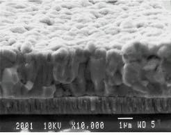 FIGURE 3. Cross section of thin-film cell shows how copper indium diselenide (CIS) forms heterojunctions with cadmium sulfide (CdS). Such thin-film cells have efficiencies in the 9%-12% range. FIGURE 3. Cross section of thin-film cell shows how copper indium diselenide (CIS) forms heterojunctions with cadmium sulfide (CdS). Such thin-film cells have efficiencies in the 9%-12% range.