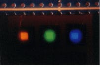 FIGURE 2. Orange-, green-, and blue-emitting LEDs with a 2 2-mm active area exhibit brightnesses of approximately 100, 100, and 60 cd/m2, respectively. FIGURE 2. Orange-, green-, and blue-emitting LEDs with a 2 2-mm active area exhibit brightnesses of approximately 100, 100, and 60 cd/m2, respectively.