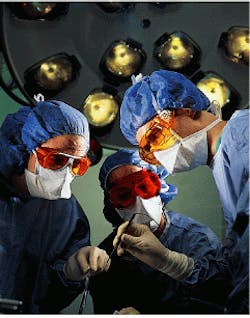 FIGURE 1. Users of lasers in surgical procedures require eye protection that is comfortable when worn for long periods and that offers complete protection from direct and reflected beams. Material durability is another concern, if the eyewear must undergo a sterilization regimen. FIGURE 1. Users of lasers in surgical procedures require eye protection that is comfortable when worn for long periods and that offers complete protection from direct and reflected beams. Material durability is another concern, if the eyewear must undergo a sterilization regimen.