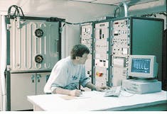 David Smith of Opticoat follows the progress of a computer-controlled coating run in a Balzers (Fremont, CA) BAK760 volume production box coater with dual electron beam guns. David Smith of Opticoat follows the progress of a computer-controlled coating run in a Balzers (Fremont, CA) BAK760 volume production box coater with dual electron beam guns.