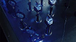 FIGURE 1. Fused silica samples are irradiated with an argon fluoride excimer laser beam to evaluate performance in 193-nm lithographic systems. Visible fluorescence is indicative of the absorption of 193-nm radiation, though the correlation between the two is not straightforward. FIGURE 1. Fused silica samples are irradiated with an argon fluoride excimer laser beam to evaluate performance in 193-nm lithographic systems. Visible fluorescence is indicative of the absorption of 193-nm radiation, though the correlation between the two is not straightforward.