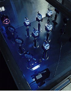 FIGURE 1. Fused silica samples are irradiated with an argon fluoride excimer laser beam to evaluate performance in 193-nm lithographic systems. Visible fluorescence is indicative of the absorption of 193-nm radiation, though the correlation between the two is not straightforward. FIGURE 1. Fused silica samples are irradiated with an argon fluoride excimer laser beam to evaluate performance in 193-nm lithographic systems. Visible fluorescence is indicative of the absorption of 193-nm radiation, though the correlation between the two is not straightforward.