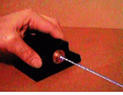 FIGURE 1. Prototype of microchip laser with power supply (top) debuted at the International Laser Display Association conference in Burlington, Canada, last fall. The first version of the laser head (bottom) emits 50 mW at 473 nm. FIGURE 1. Prototype of microchip laser with power supply (top) debuted at the International Laser Display Association conference in Burlington, Canada, last fall. The first version of the laser head (bottom) emits 50 mW at 473 nm.