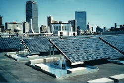 Northeastern University Ell Student Center hosts an 18-kW grid-connected array of photovoltaic cells on its roof. The Boston skyline is in the background. Northeastern University Ell Student Center hosts an 18-kW grid-connected array of photovoltaic cells on its roof. The Boston skyline is in the background.