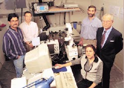 Watt Webb (far right) and his research team at Cornell University (Ithaca, NY) used nonlinear laser-microscope technology to produce images displaying the neurotransmitter serotonin in live cells in real time. The microscope can record ultraviolet fluorescence images of live cells without using UV illumination to detect and image cellular activity. Watt Webb (far right) and his research team at Cornell University (Ithaca, NY) used nonlinear laser-microscope technology to produce images displaying the neurotransmitter serotonin in live cells in real time. The microscope can record ultraviolet fluorescence images of live cells without using UV illumination to detect and image cellular activity.