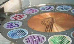 FIGURE 3. Hard-coated ultraviolet filters are manufactured with advanced plasma reactive sputtering. FIGURE 3. Hard-coated ultraviolet filters are manufactured with advanced plasma reactive sputtering.