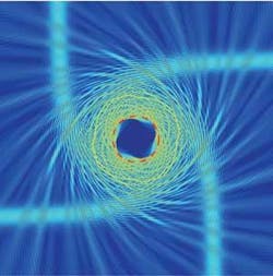 FIGURE 4. In an optical analog of a black hole, light spirals inward through an air-InGaAsP metamaterial structure.