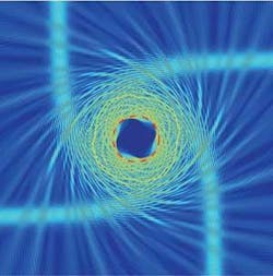 FIGURE 4. In an optical analog of a black hole, light spirals inward through an air-InGaAsP metamaterial structure. FIGURE 4. In an optical analog of a black hole, light spirals inward through an air-InGaAsP metamaterial structure.