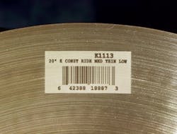 FIGURE 3. A high-contrast laser-marked barcode for Zildjian's cymbals contains a lot number, job number, and serial number. FIGURE 3. A high-contrast laser-marked barcode for Zildjian's cymbals contains a lot number, job number, and serial number.