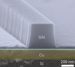 A nanoscale silicon nitride (SiN)-on-copper (Cu) plasmonic waveguide on a silicon (Si) chip is imaged via electron microscopy. A nanoscale silicon nitride (SiN)-on-copper (Cu) plasmonic waveguide on a silicon (Si) chip is imaged via electron microscopy.