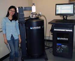 Yue Huang, Brown University postdoctoral research associate and a member of the Mittleman Lab research team, shown next to the Lake Shore Cryotronics 8500 Series terahertz system for material characterization installed in the lab. Huang&rsquo;s current research interests lie in the optical properties of Dirac semimetals and iron-based superconductors using terahertz spectroscopy in magnetic fields.