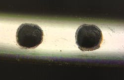 FIGURE 2. This clean, debris-free cut in a stainless steel foil highlights the advantages of femtosecond lasers for thin material processing.