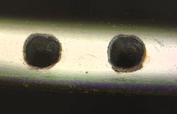 FIGURE 2. This clean, debris-free cut in a stainless steel foil highlights the advantages of femtosecond lasers for thin material processing. FIGURE 2. This clean, debris-free cut in a stainless steel foil highlights the advantages of femtosecond lasers for thin material processing.