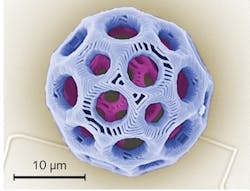 FIGURE 3. A colorized SEM image is shown of a complex 3D microstructure created by carefully overlapping polymer voxels to form a continuous polymeric network capable of sustaining itself.
