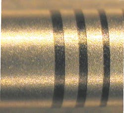 FIGURE 4. An example of a UV laser mark on 17-4 stainless steel after hot nitric passivation. FIGURE 4. An example of a UV laser mark on 17-4 stainless steel after hot nitric passivation.