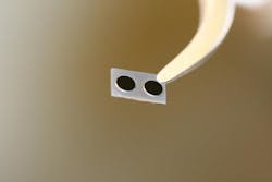 Solitons are created in optical microcavities like these, where the solitary waves circle around the tiny disks at the speed of light. Solitons are created in optical microcavities like these, where the solitary waves circle around the tiny disks at the speed of light.