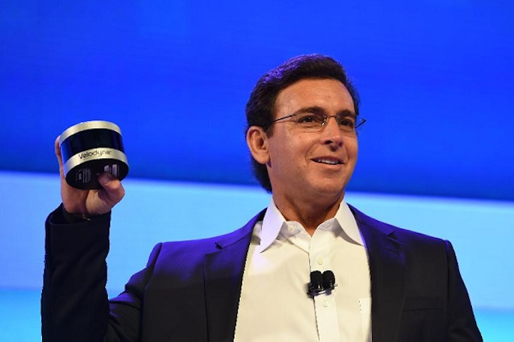 Ford CEO Mark Fields shows off the Velodyne Puck sensor at a press conference on CES Press Day, January 5, 2016 in Las Vegas, NV ahead of the CES 2016 Consumer Electronics Show. The new Velodyne lidar models will be fitted into the side view mirrors of Ford’s Fusion Hybrid self-driving cars. (Image credit: Robyn Beck/AFP/Getty Images)
