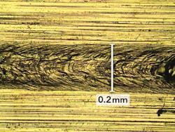 FIGURE 2. The upper surface of an aluminum-to-copper weld. FIGURE 2. The upper surface of an aluminum-to-copper weld.