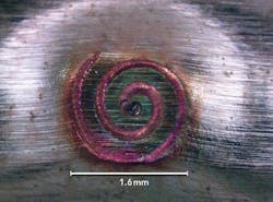 FIGURE 6. The upper surface of a spiral-weld failure in 50μm-thick copper at 180W. FIGURE 6. The upper surface of a spiral-weld failure in 50μm-thick copper at 180W.