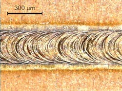 FIGURE 4. A copper optical fiber (99.95% copper) weld seam created at speeds up to 42m/min. FIGURE 4. A copper optical fiber (99.95% copper) weld seam created at speeds up to 42m/min.