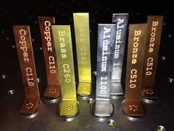 FIGURE 1. Examples of various metals welded to stainless steel buttons. FIGURE 1. Examples of various metals welded to stainless steel buttons.