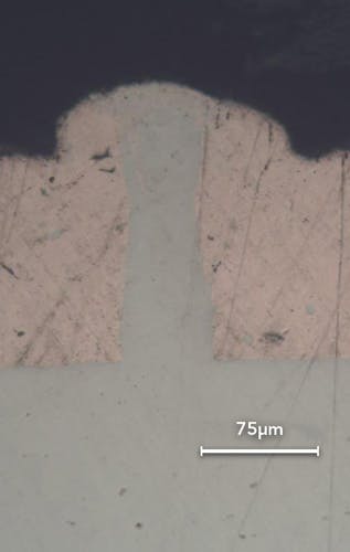 FIGURE 2. A cross-section of copper (top) into aluminum (bottom) weld using a redENERGY G4 pulsed laser.