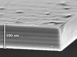 FIGURE 3. A scanning-electron microscope (SEM) image shows the 590-nm-thick free-standing membrane; the 20 quantum-well (QW) layers, arranged in 5 groups of 4 QWs each, are identified as lighter stripes. FIGURE 3. A scanning-electron microscope (SEM) image shows the 590-nm-thick free-standing membrane; the 20 quantum-well (QW) layers, arranged in 5 groups of 4 QWs each, are identified as lighter stripes.