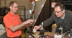 John Ballato (left) and Lin Zhu are receiving a combined $3.2 million from the Department of Defense to develop high-energy lasers. John Ballato (left) and Lin Zhu are receiving a combined $3.2 million from the Department of Defense to develop high-energy lasers.