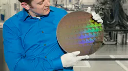 IBM Research scientist Nicolas Loubet holds a wafer of chips with 5nm silicon nanosheet transistors manufactured using an industry-first process that can deliver 40 percent performance enhancement at fixed power, or 75% power savings at matched performance.