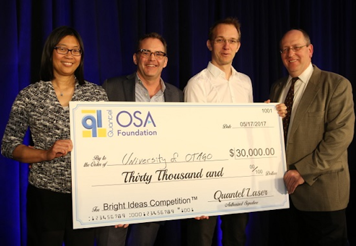 Quantel Laser and the OSA Foundation awarded a check to Harald Schwefel of the University of Otago in New Zealand as the winner of the Bright Ideas Competition for his work in photon-triplet generation for quantum optics and secure communication. (Image credit: Quantel Laser)