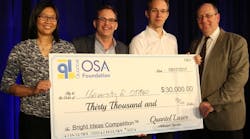 Quantel Laser and the OSA Foundation awarded a check to Harald Schwefel of the University of Otago in New Zealand as the winner of the Bright Ideas Competition for his work in photon-triplet generation for quantum optics and secure communication.